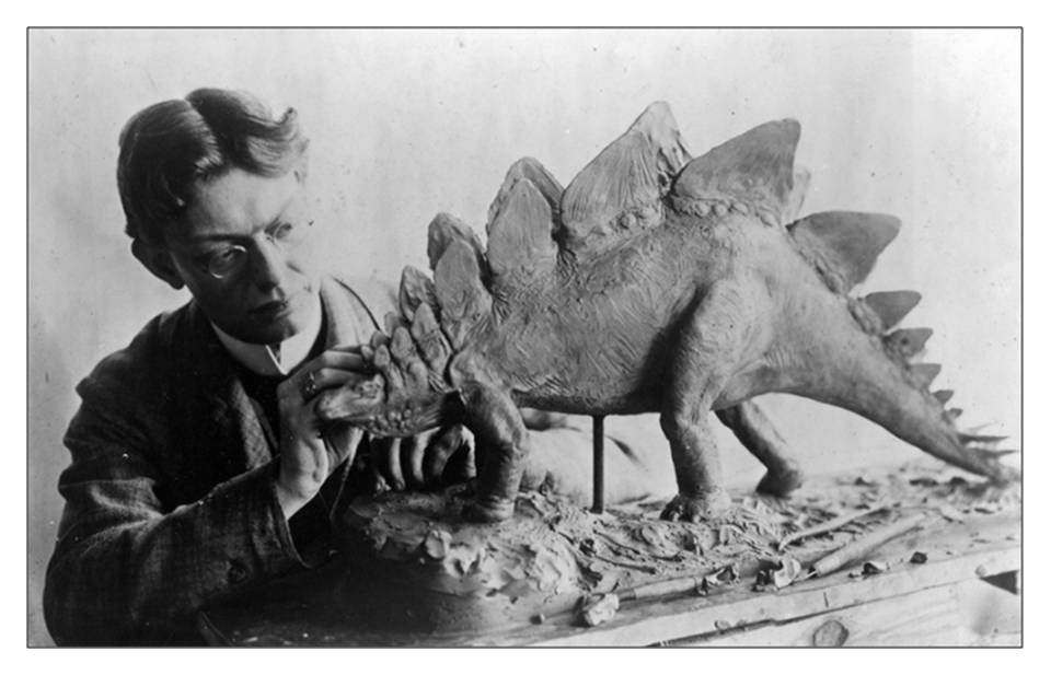 Picture of Charles R. Knight working on Stegosaur model